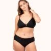 The Ribbed Busty Bralette: Jet Black -Livery Store 1 on model front ribbed busty bralette jet black 66d161de d649 4ce2 baa0 8bf59e4f4b23