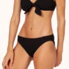 The Swim Ruched Bikini Bottom: Jet Black -Livery Store 1 on model front ruched bikini jet black