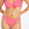 The Swim Ruched Bikini Bottom: Electric Pink -Livery Store 1 on model front swim ruched bikini bottom electric pink