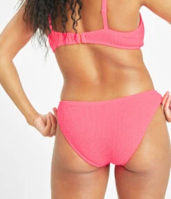 The Swim Ruched Bikini Bottom: Electric Pink -Livery Store 3 on model back swim ruched bikini bottom electric pink