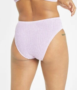 The Swim Ruched High Waist Bikini Bottom: Lilac -Livery Store 3 on model back swim ruched high waist bikini bottom lilac