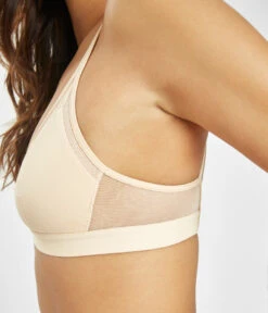 The Mesh Trim Padded Bralette: Toasted Almond -Livery Store 3 on model side1 mesh trim padded bralette toasted almond