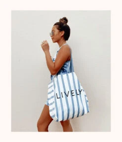 The Denim Stripe Tote - GWP: Denim Stripe -Livery Store 3 on model ugc front denim stripe tote denim stripe