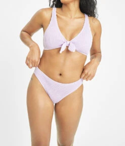 The Ruched Plunge Bralette & Bikini Swim Bundle: Lilac -Livery Store 5 on model front swim ruched bikini bottom lilac